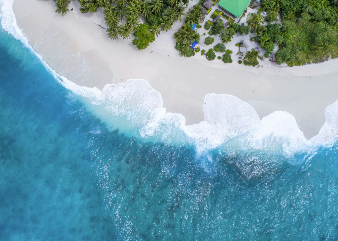 A turquoise coastline seen from above